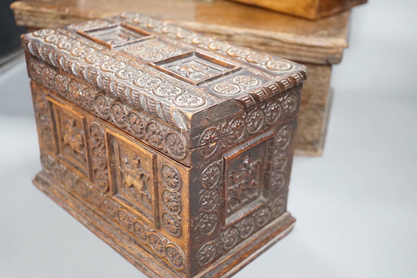 An early 18th century oak bible box containing a Victorian Morocco leather photograph album, together with two 19th century wooden boxes (4)